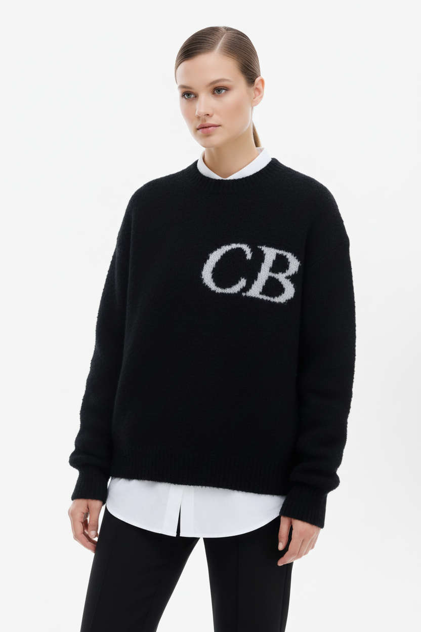 Woman wearing black CB logo sweater